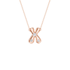 A rose gold necklace featuring an 'X' shaped pendant with three clear gemstones, set against a solid white background.