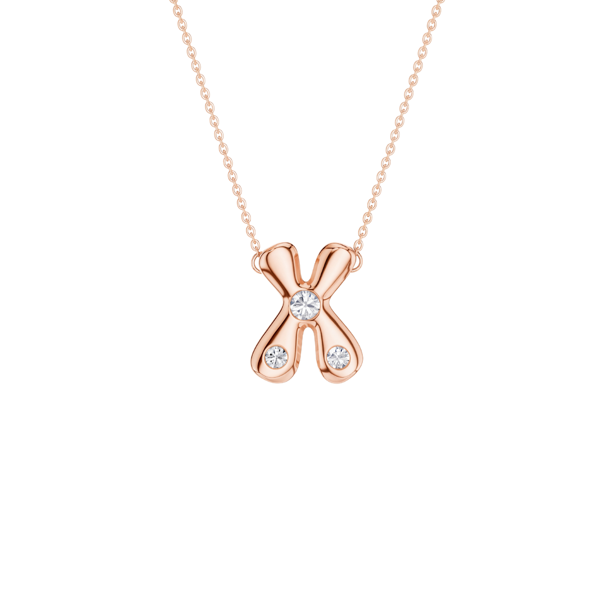 A rose gold necklace featuring an 'X' shaped pendant with three clear gemstones, set against a solid white background.