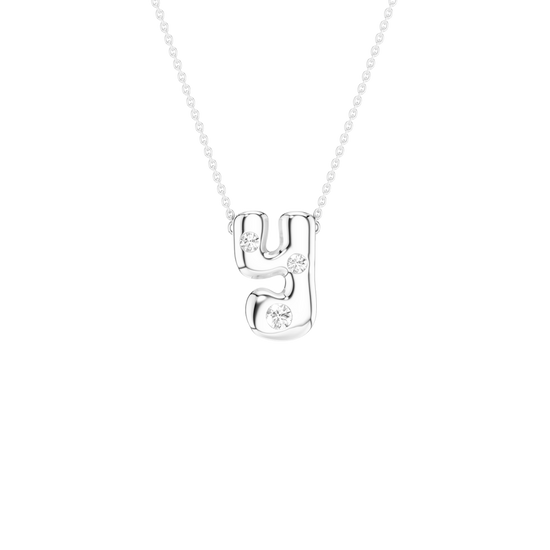 A silver initial pendant necklace featuring the letter 'Y' adorned with small clear gemstones, suspended from a delicate silver chain against a solid white background.