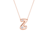 A rose gold initial necklace featuring the letter 'Z' adorned with three small clear gemstones, suspended from a delicate matching chain against a solid white background.