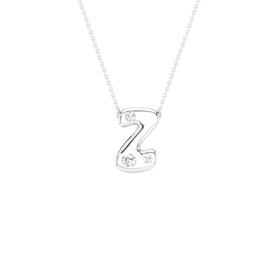 A silver initial necklace featuring the letter 'Z' adorned with small clear crystals, suspended from a delicate silver ball chain against a solid white background.