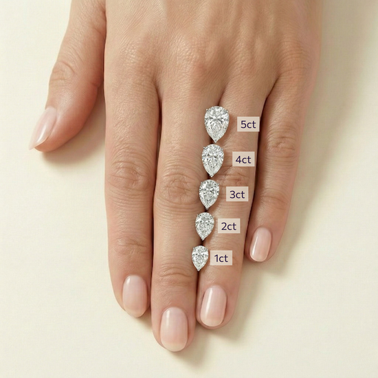 On-hand comparison of pear cut diamonds from 1 carat, 2 carat, 3 carat, 4 carat, 5 carat.