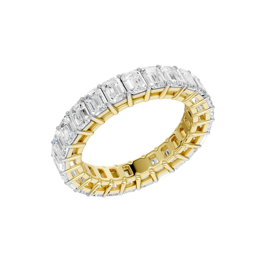 An angled view of a 14K yellow gold eternity band, showcasing the impressive brilliance of the rectangular jewels.