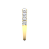 A side-profile view of a 14K yellow gold eternity ring, showing the clean, open setting of the diamonds.
