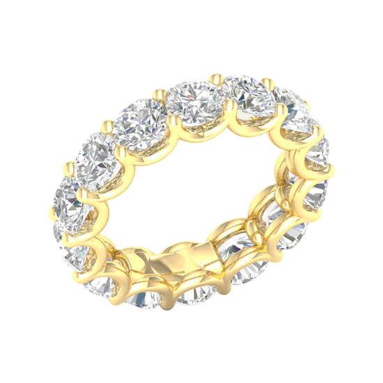 An angled view of a 14K yellow gold ring, showcasing the seamless brilliance of the bezel-set jewels.
