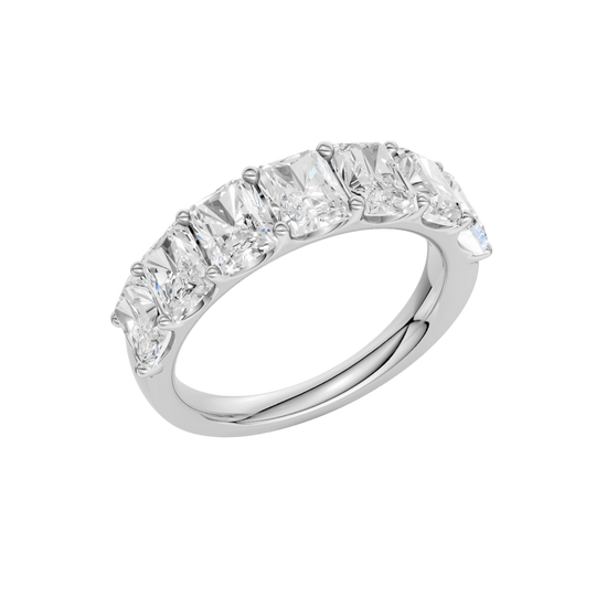An angled view of a 14K white gold wide band ring, showcasing the clean, bold lines of the emerald-cut diamonds.