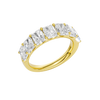 An angled view of a 14K yellow gold wide band ring, showcasing the clean, bold lines of the emerald-cut diamonds.