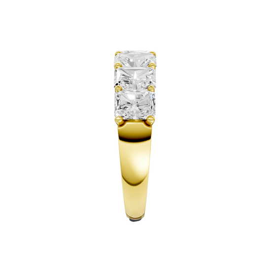 A side-profile view of a 14K yellow gold wide band ring, showing the secure setting and the five diamonds.