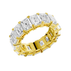 An angled view of a 14K yellow gold eternity band, highlighting the magnificent sparkle of the rectangular jewels.