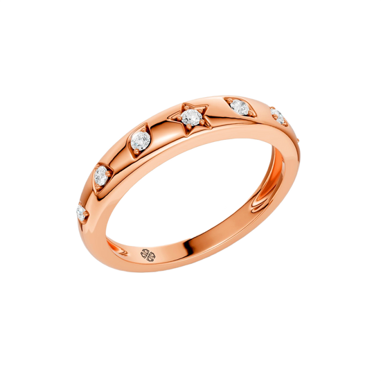 Angled view of the Fourteenth Collection geometric studded diamond stackable ring in polished rose gold, featuring star and geometric bezel-set round diamonds across a slim, high-shine band.