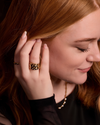 A bold, high-polish 14k yellow gold statement ring by Amorati featuring scattered star and geometric insets with shimmering round-grown diamonds. Amorati’s signature F O U R T E E N T H Collection.