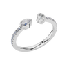 An angled view of a 14K white gold bypass ring, showcasing the pear-shaped diamond and the pavé band.