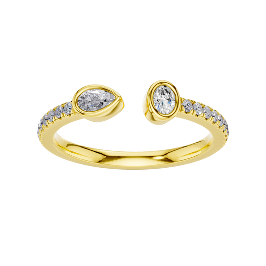 A top-down view of a 14K yellow gold bypass ring with a pear-shaped diamond on one side and a pavé diamond band on the other.