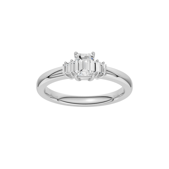 A top-down view of a 14K white gold ring with a central rectangular jewel and two smaller round gems on the sides.