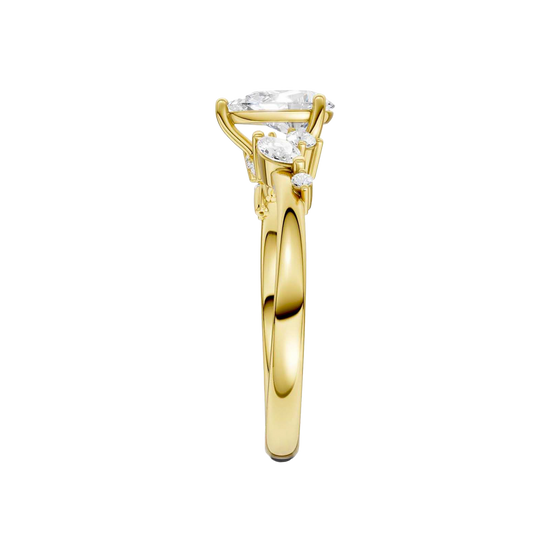 A side-profile view of a 14K yellow gold ring, showing the graceful setting of the three gems.