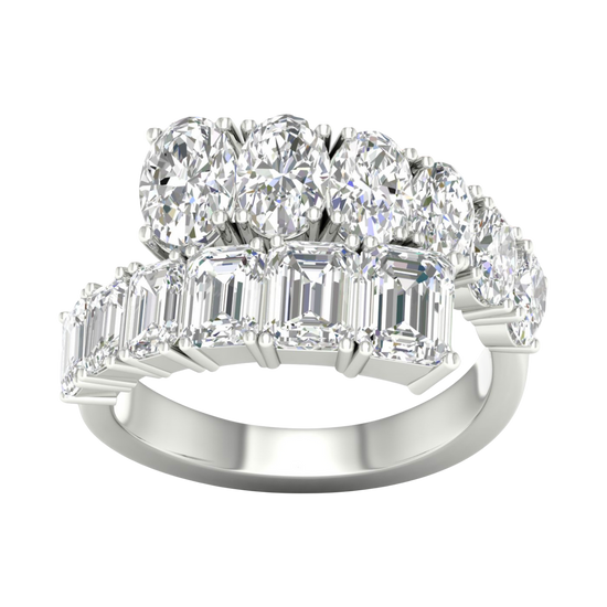A top-down view of a 14K white gold ring with a large, asymmetrical cluster of pear and baguette diamonds.