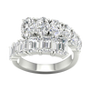 A top-down view of a 14K white gold ring with a large, asymmetrical cluster of pear and baguette diamonds.