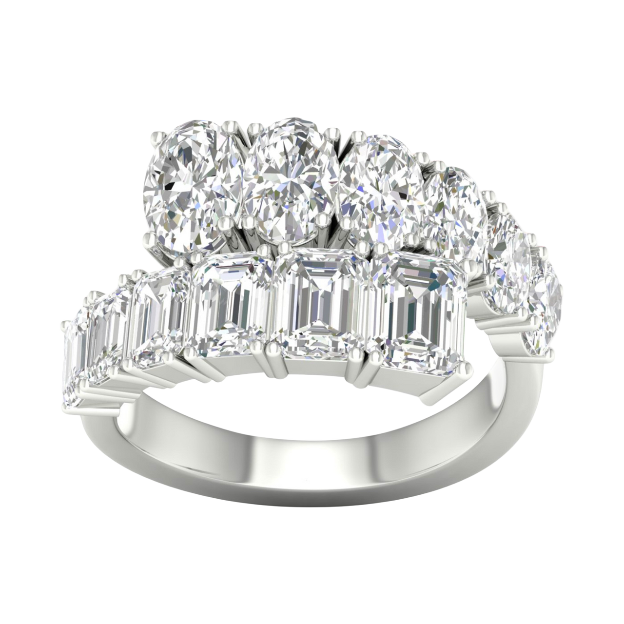 A top-down view of a 14K white gold ring with a large, asymmetrical cluster of pear and baguette diamonds.
