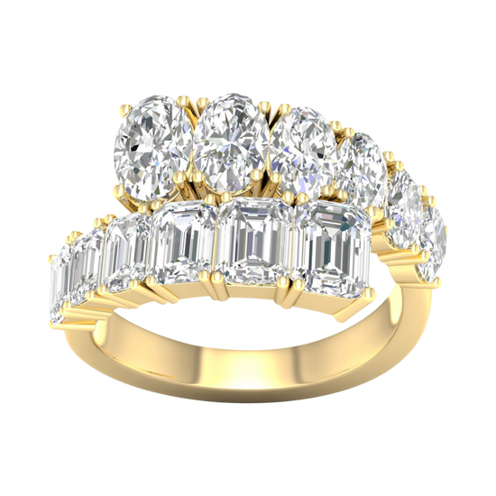 A top-down view of a 14K yellow gold ring with a large, asymmetrical cluster of pear and baguette diamonds.