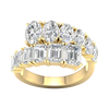 A top-down view of a 14K yellow gold ring with a large, asymmetrical cluster of pear and baguette diamonds.