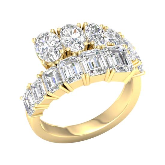 An angled view of a 14K yellow gold ring, showcasing the brilliant, mixed-shape diamond cluster.