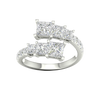 A top-down view of a 14K white gold ring with an asymmetrical cluster of princess-cut and baguette diamonds.