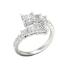 An angled view of a 14K white gold ring, showcasing the brilliant, architectural diamond cluster.