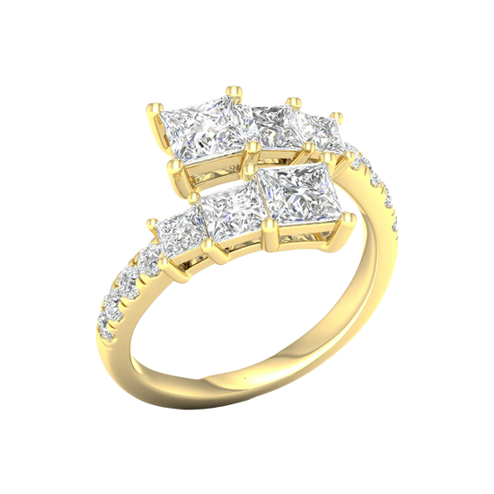 An angled view of a 14K yellow gold ring, showcasing the brilliant, architectural diamond cluster.