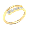 An angled view of a 14K yellow gold open-shank ring, showcasing the brilliant bezel-set diamonds in a swirling design.