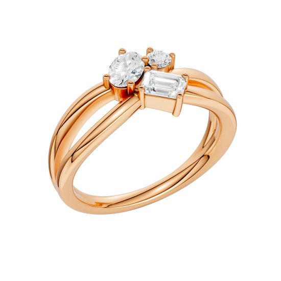 An angled view of a 14K rose gold bypass ring, showcasing the baguette cluster and the curved band.