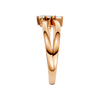 A side-profile view of a 14K rose gold bypass ring, showing the fluid band and the three baguette diamonds.