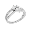 An angled view of a 14K white gold bypass ring, showcasing the baguette cluster and the curved band.