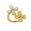 Angled view of a yellow gold floral diamond ring highlighting the dimensional flower motif, marquise-cut diamond sparkle, and high-polish gold finish.