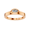 A top-down view of a 14K rose gold bypass ring with a single, horizontally-set oval diamond in a bezel setting.