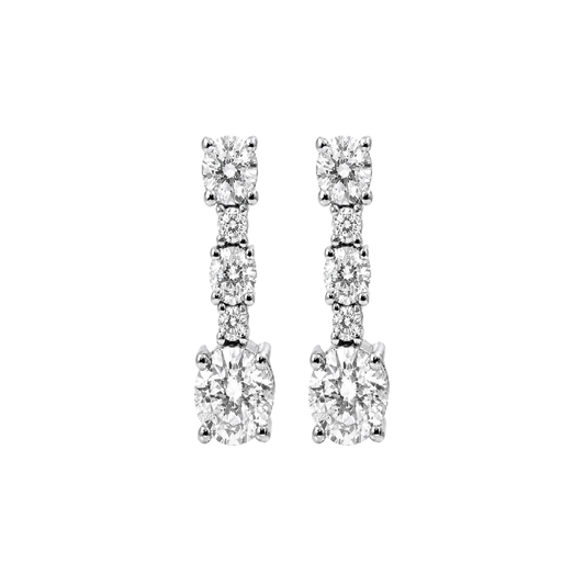A pair of silver-toned drop earrings featuring multiple round-cut clear gemstones arranged in a vertical baroque-style design, shown against a plain white background.