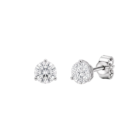 Side angle view of round diamond stud earrings showing the metal posts and butterfly backs.