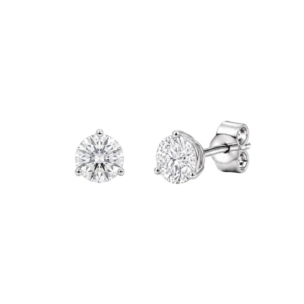 Side angle view of round diamond stud earrings showing the metal posts and butterfly backs.