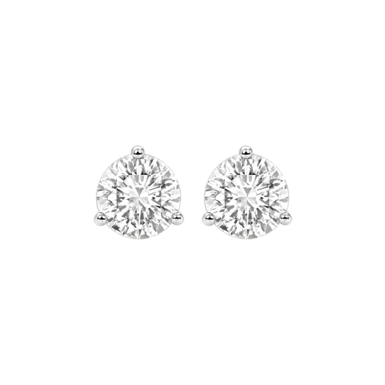 Close-up front view of two round-cut diamond stud earrings in three-prong settings.