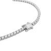 A close-up studio shot of a tennis-style necklace with a silver-toned clasp and clear stones, photographed on a clean white background.