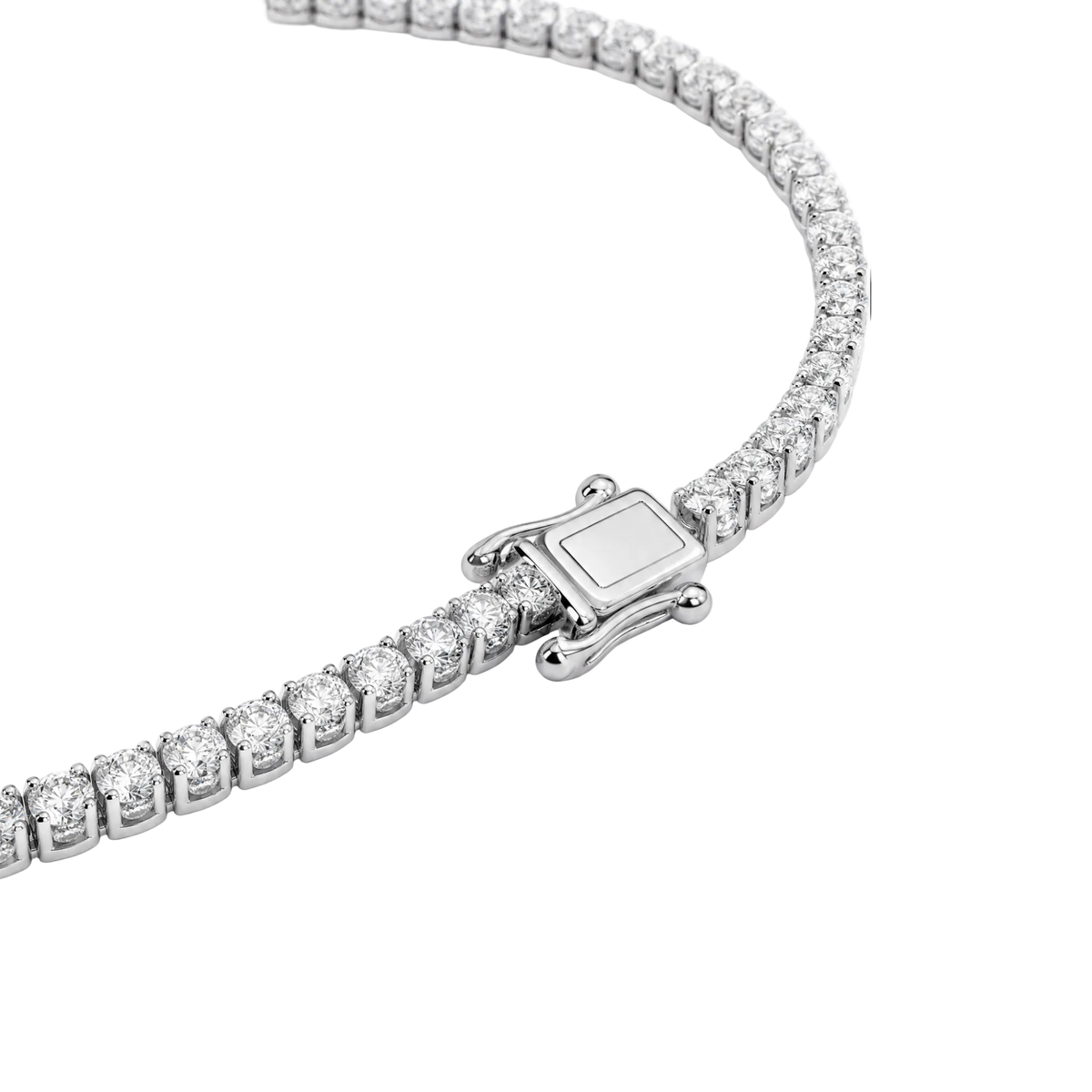 A close-up studio shot of a tennis-style necklace with a silver-toned clasp and clear stones, photographed on a clean white background.