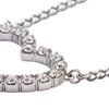 Close-up of a silver-toned tennis bracelet with clear round-cut stones, shown on a plain white background.
