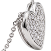 A close-up of a silver heart-shaped pendant necklace, partially open to reveal a heart-shaped locket filled with pavé-set clear gemstones, attached to a silver chain against a white background.