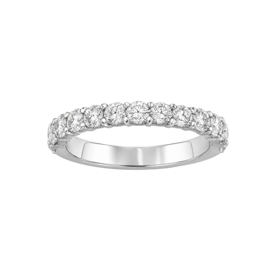 A silver diamond eternity ring with a row of round-cut diamonds set in a polished silver band, shown against a plain white background.