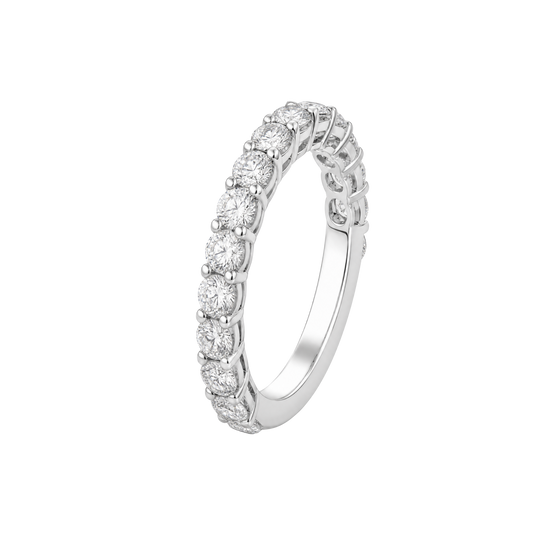 A silver-toned eternity ring featuring a continuous row of round-cut clear gemstones in a prong setting, shown on a plain white background.