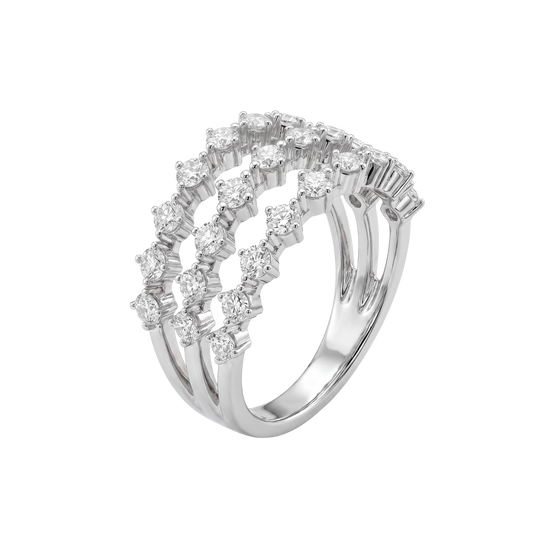 A silver-tone ring featuring three parallel bands with rows of clear round-cut and baguette-cut stones, shown on a plain white background.