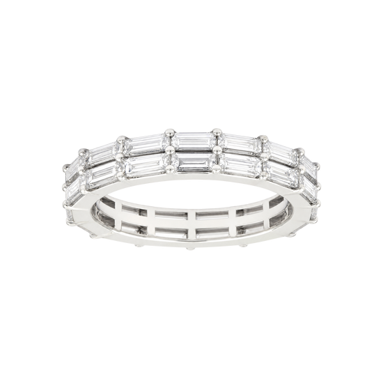 A silver eternity ring featuring baguette-cut clear gemstones set in a polished silver band, shown against a plain white background.