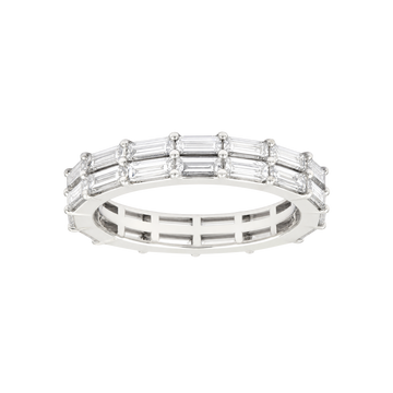 A silver eternity ring featuring baguette-cut clear gemstones set in a polished silver band, shown against a plain white background.