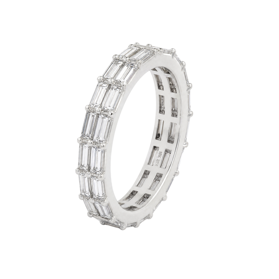 A silver eternity ring featuring baguette-cut clear stones set in a polished silver band, shown on a pure white background.