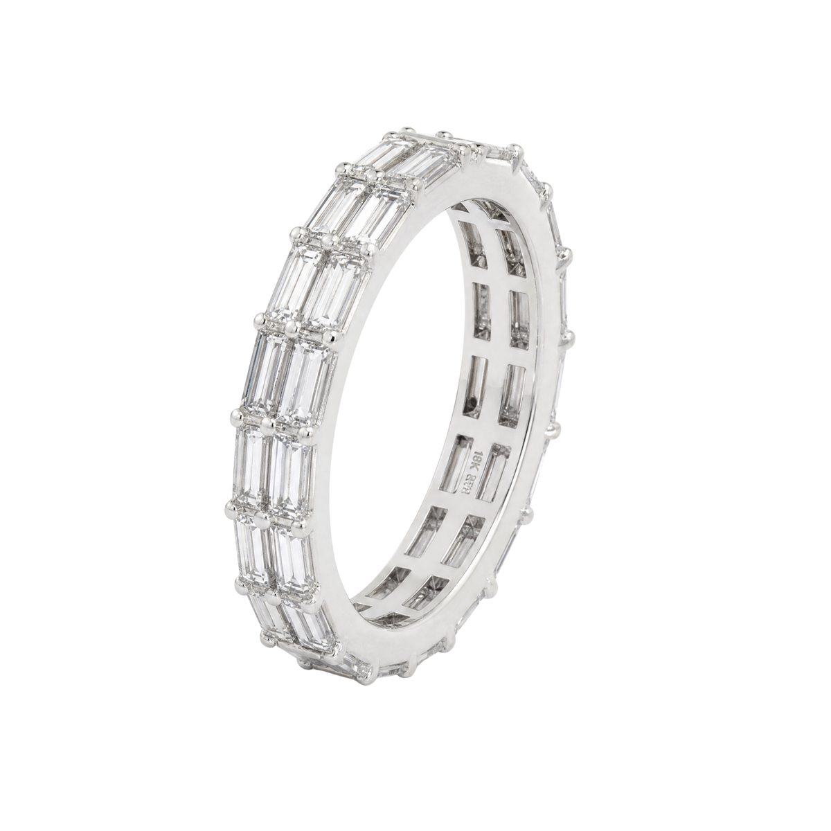 A silver eternity ring featuring baguette-cut clear stones set in a polished silver band, shown on a pure white background.