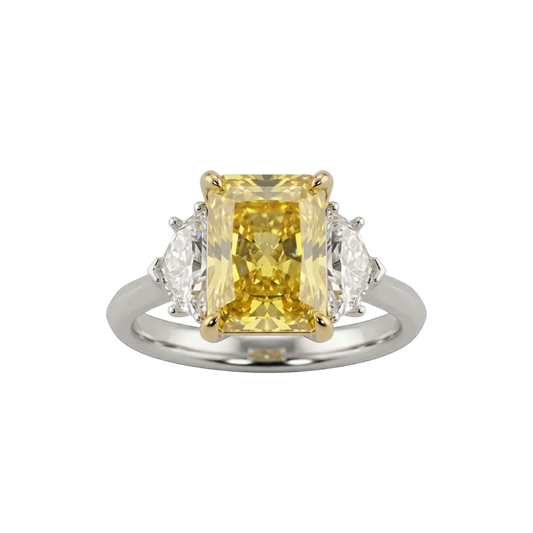 A top-down view of a three-stone engagement ring against a solid black background. The center features a large, pastel yellow emerald-cut diamond set in four yellow gold prongs. It is flanked by two smaller, clear white diamond side stones. The band of the ring is a smooth, polished white metal.